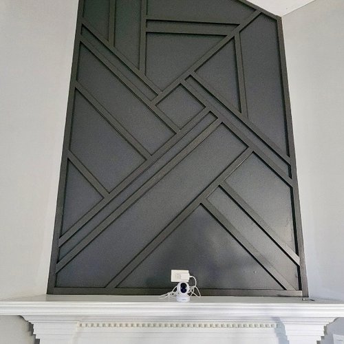 Contemporary fireplace design with tile and accents in Greenwood home