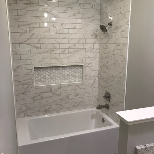 Floor Tech Corp bathroom remodel featuring tile walls and flooring in Central Indiana