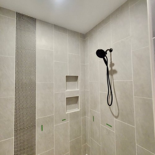 “Stylish bathroom remodel showcasing tile, flooring, and modern finishes in Central Indiana